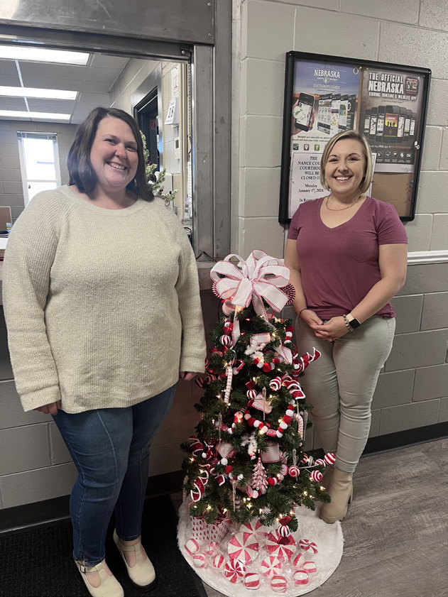 Karley Collins and Adrian Chlopek stand by their winning tree. NCJ photos by April Carr