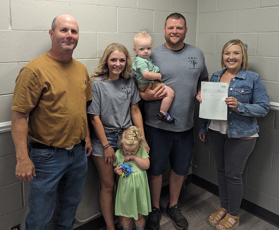 Pictured are Tim Cornwell (Board of Supervisors Chairperson), Abigail Bishop and Tony Steensnes and their children Harper and Maverick (Owners of T & A’s Tree Service, LLC) and Adrian Chlopek (NCDA Director).