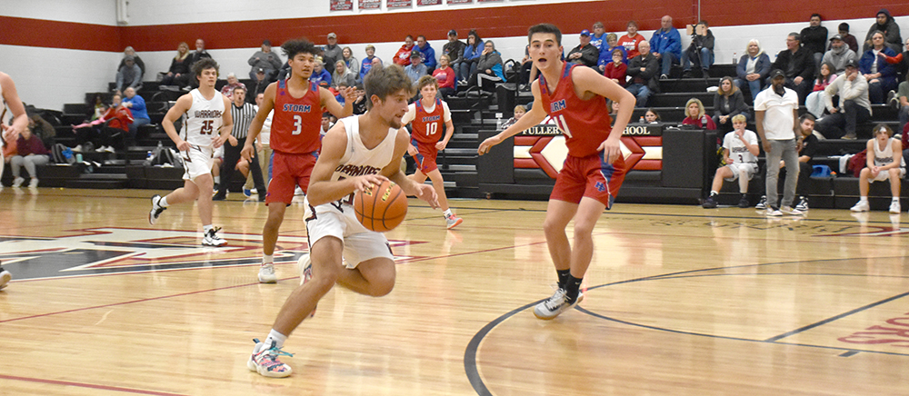 Fletcher Dubas dribbles past an opponent. NCJ photo by Beth Sparrow