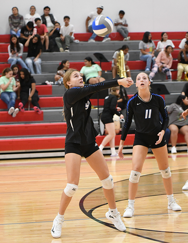 Callie Held keeps the ball alive during the third set against Madison. NCJ photo by Rick Holtz