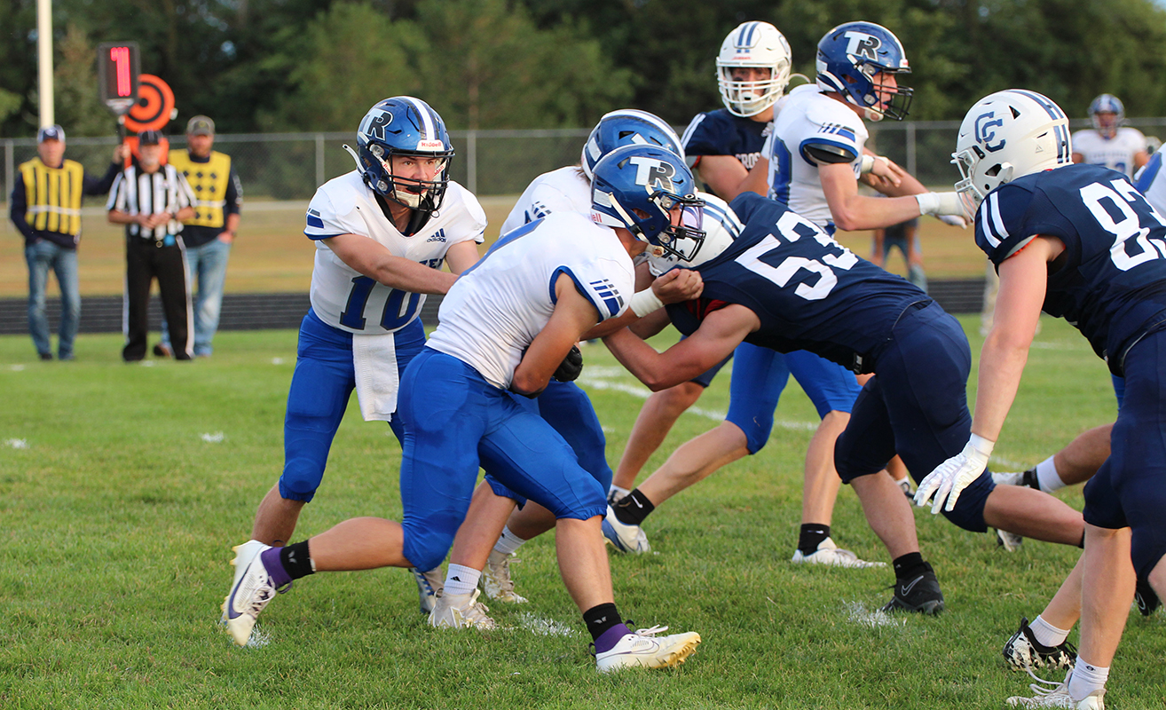 Kadin Buhl fakes the handoff to Landyn Roebuck on Friday against the Cougars. NCJ photo by Travis Lane