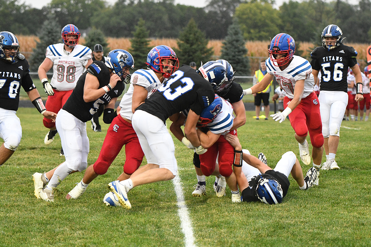 Kirk Hebda stops the Clarkson/Leigh ball carrier in the first quarter on Friday. Hebda finished with a game-high 19 tackles for the Titans. NCJ photo by Rick Holtz