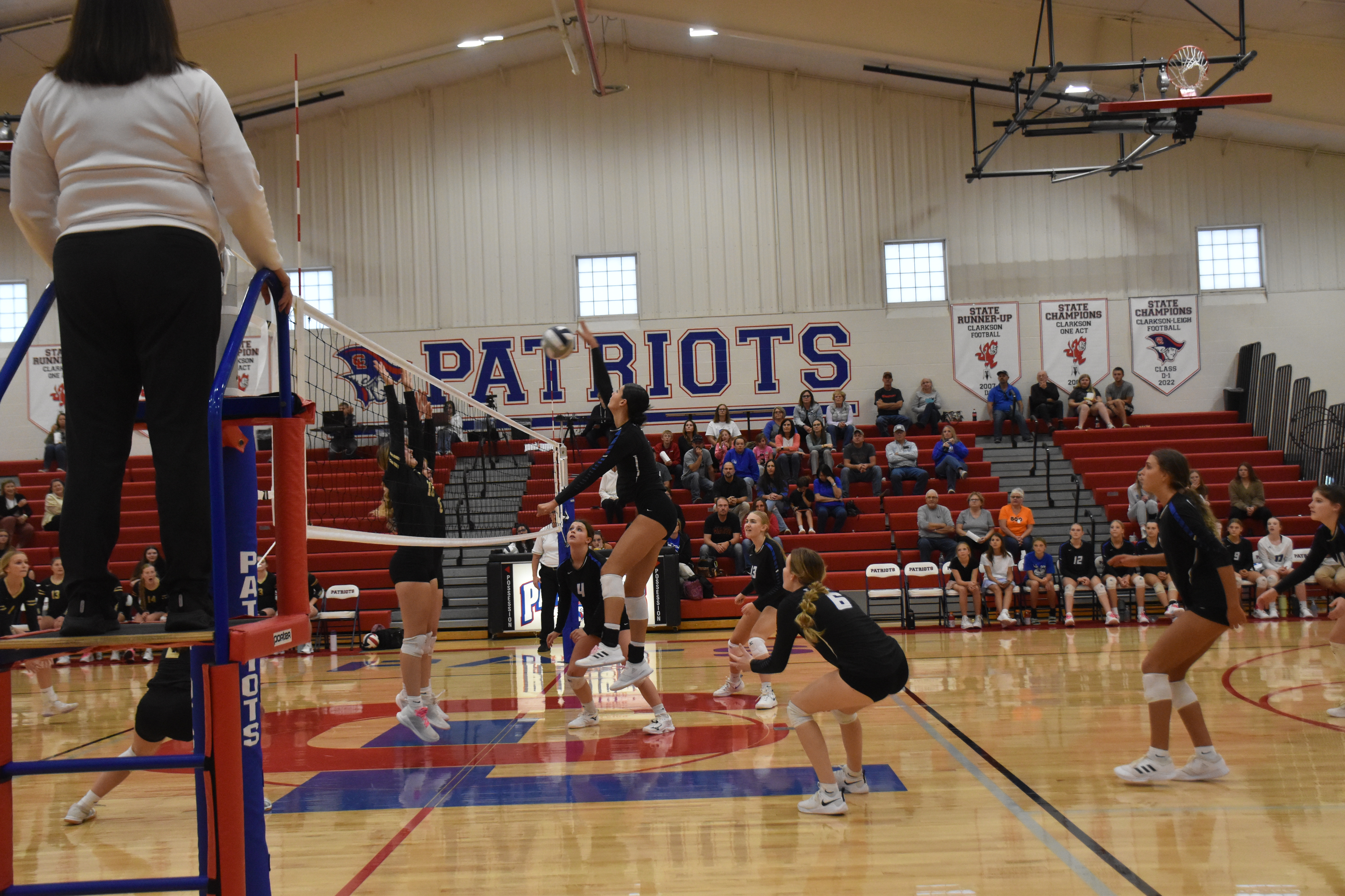 Chloe Pilakowski goes on the attack as the rest of the Titans move into position. NCJ photo by Beth Sparrow