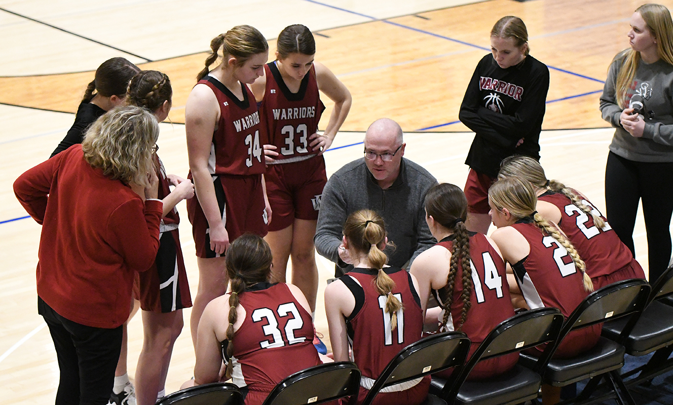 Fullerton coach Jason Maxfield talks things over with the Warriors during a timeout in one of the three overtimes on Thursday. NCJ photos by Rick Holtz