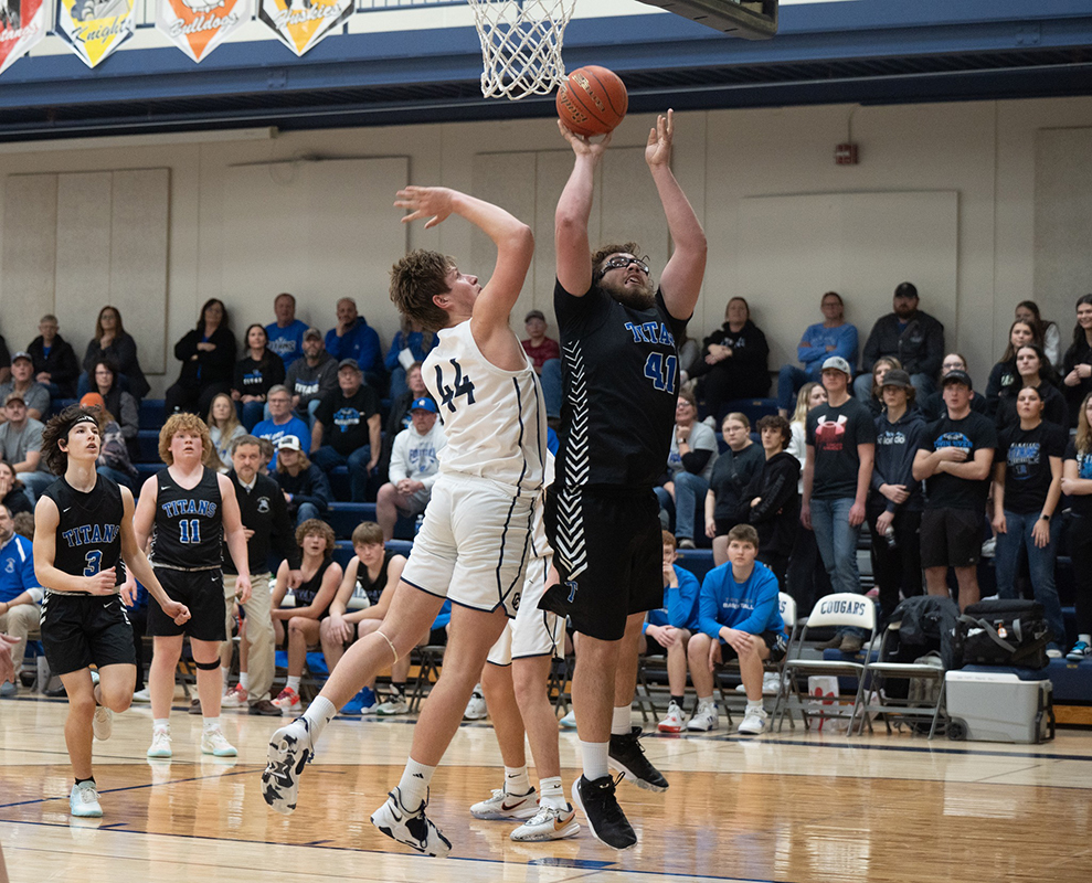 Ryder Kleckner makes a strong move to the basket. He finished with 12 points against Cross County. Photo by Lana Hebda