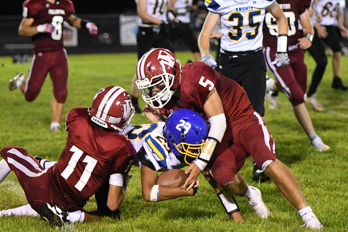 Fletcher Dubas and Kyle Horn converge on the ball to stop the Knight's offense. NCJ photo by Calvin Holtz