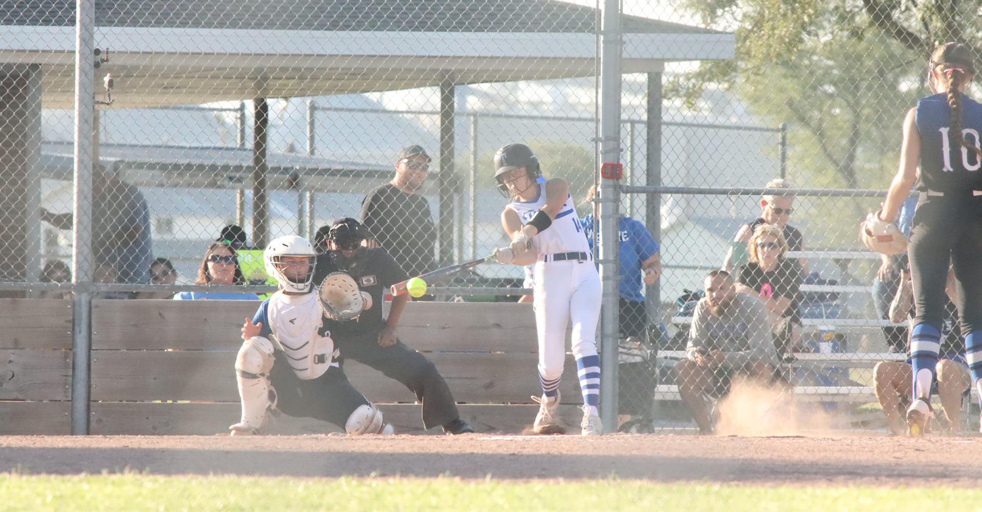 Adalyn Bishop drives the ball for an RBI single in the Titans win over the GACC Bluejays. NCJ photo by Ken Kush
