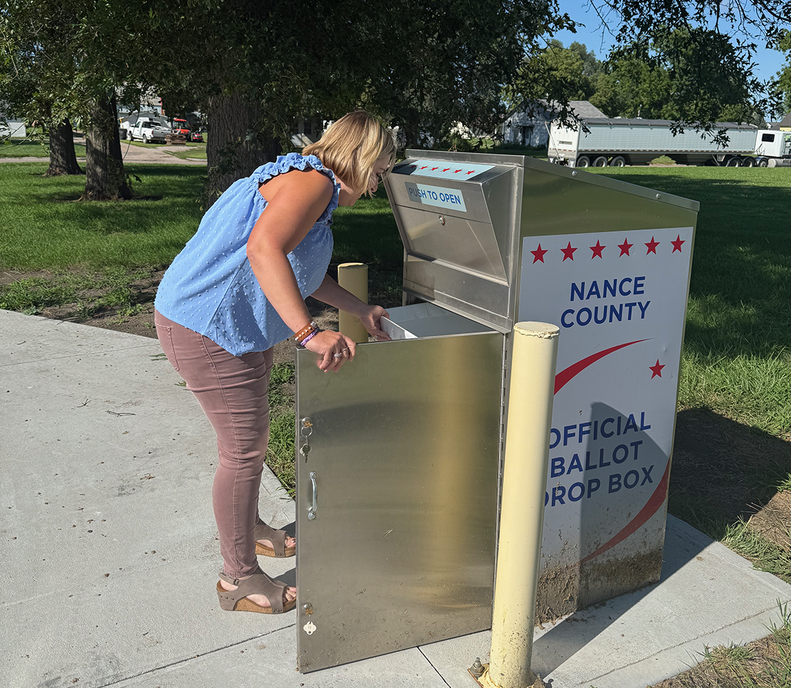 Nance County Clerk Adrian Chlopek checks the drop box in the back of the courthouse for last minute ballots on Tuesday evening. NCJ photo by Rick Holtz