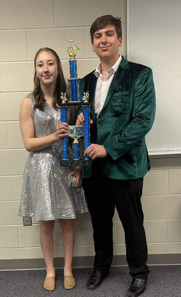 8th and Broadway dance captains Tori Decker and Terrick Gonsior accept the show choir’s second place trophy. Photo provided
