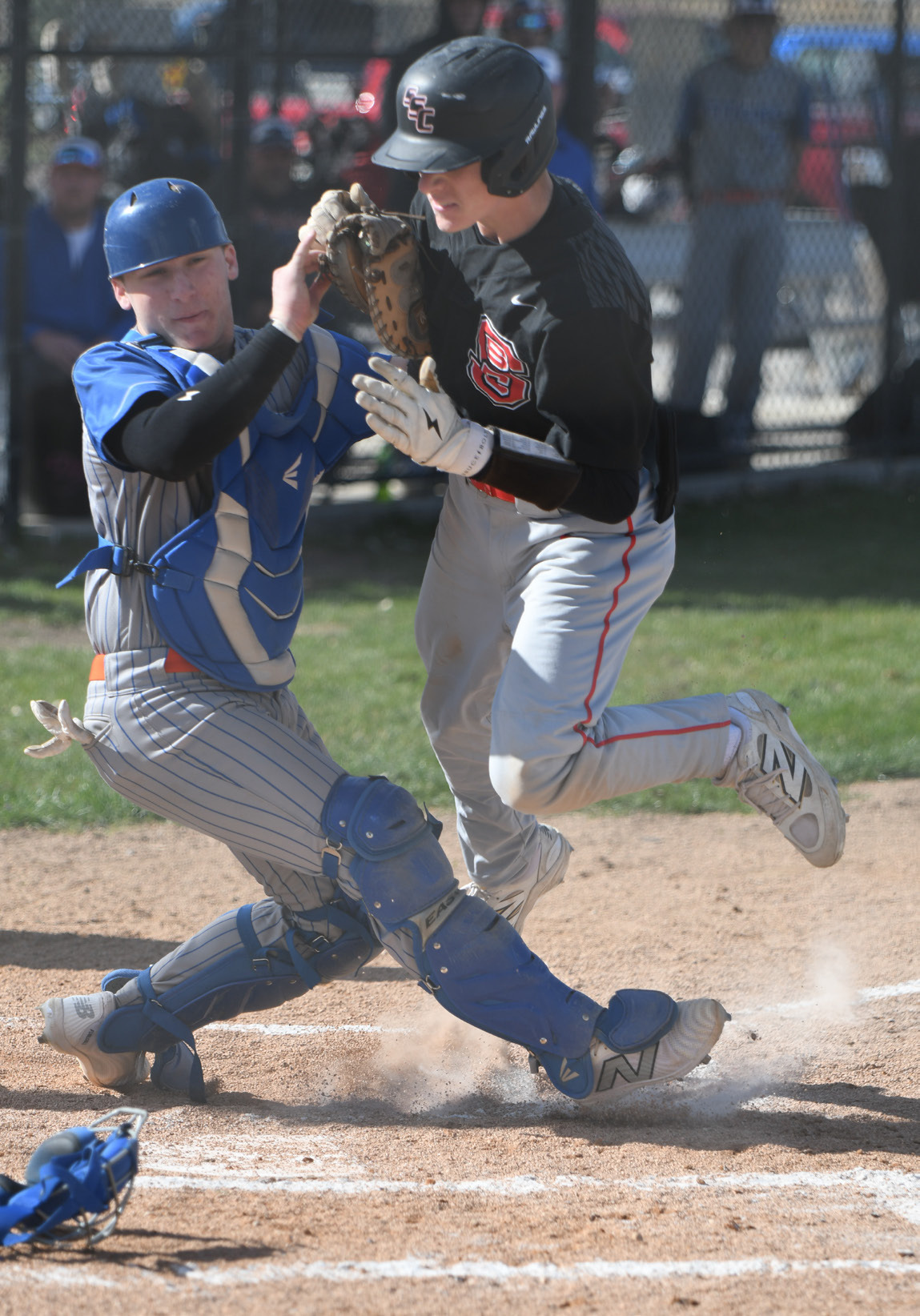 Titan catcher Aden Feezell makes the play at home to save a run on Thursday. NCJ photo by Rick Holtz