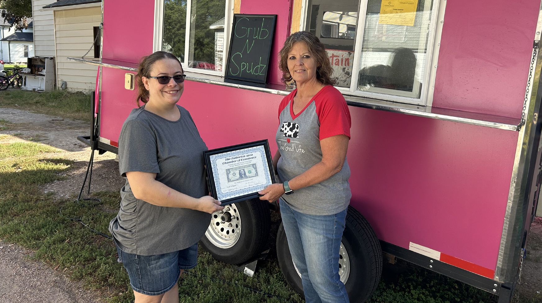 The Fullerton Area Chamber of Commerce welcomes Grub N Spudz to the community. Brittney Province said she started her business back in July. Brittney (left) is presented with a Dollar Award. Photo provided