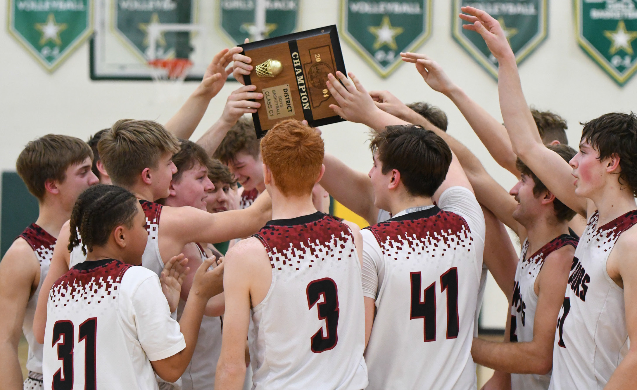 Fullerton celebrates at midcourt after defeating Garden County 48-29 to win the D2-6 District Final. The Warriors punched their ticket to state for the first time since 2020. 