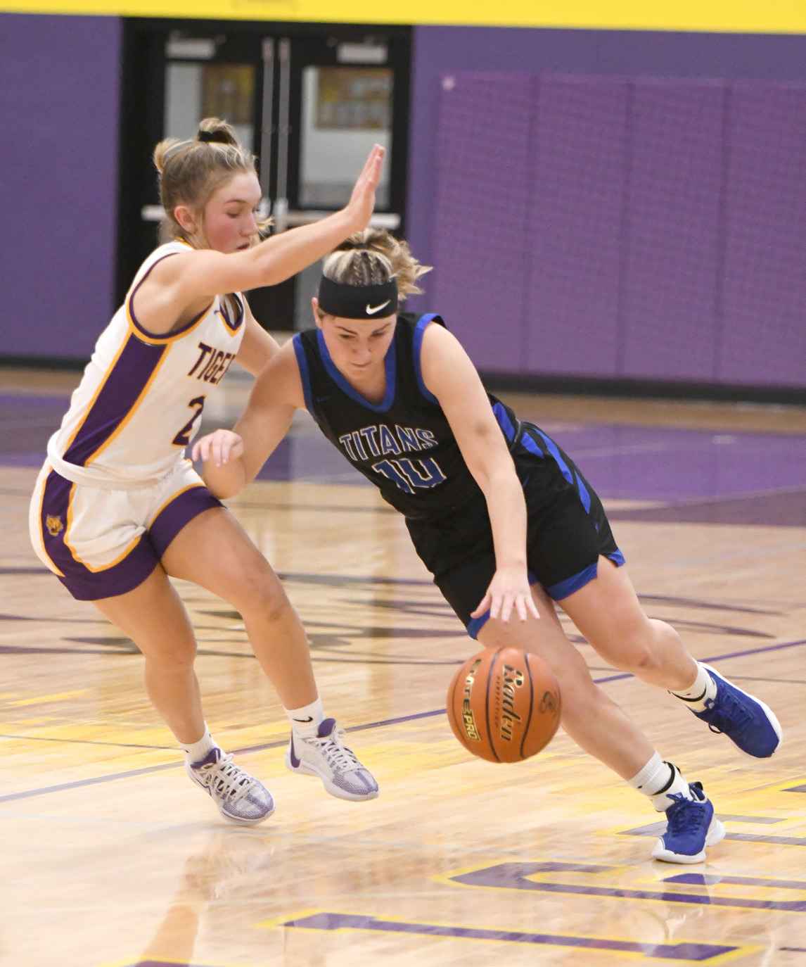 Delaney Reeg fights to push the ball against the Tiger pressure defense in the first half. NCJ photo by Rick Holtz