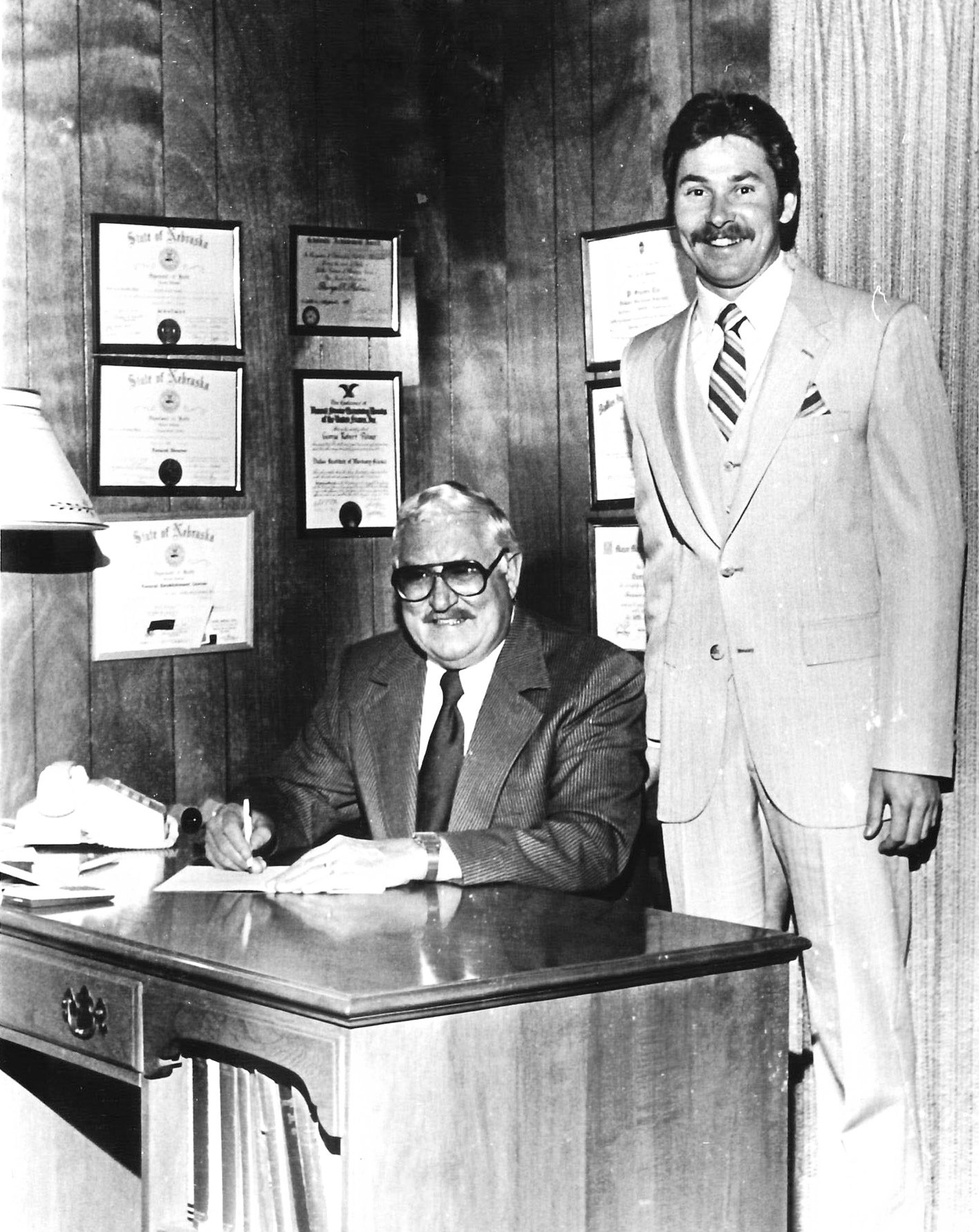 George Palmer (right) began working for his father, Robert, as a funeral director in Fullerton in 1974. This month marks his 50th year serving the Fullerton community. Photo provided