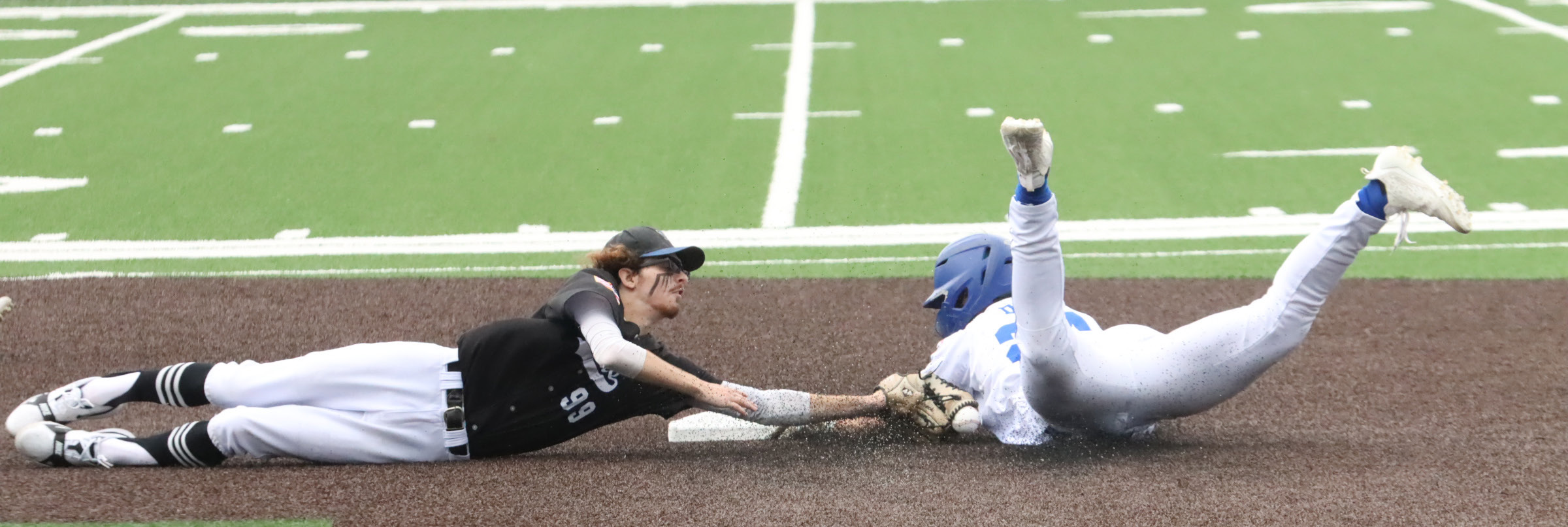 Twin River second baseman Tim Jarecki lunges to make the tag on the Seward base runner during Friday second game of the Class B Area 4 Tournament in York. Jarecki’s tag was not in time as Seward went on to the 8-0 five inning win. NCJ photos by Ken Kush