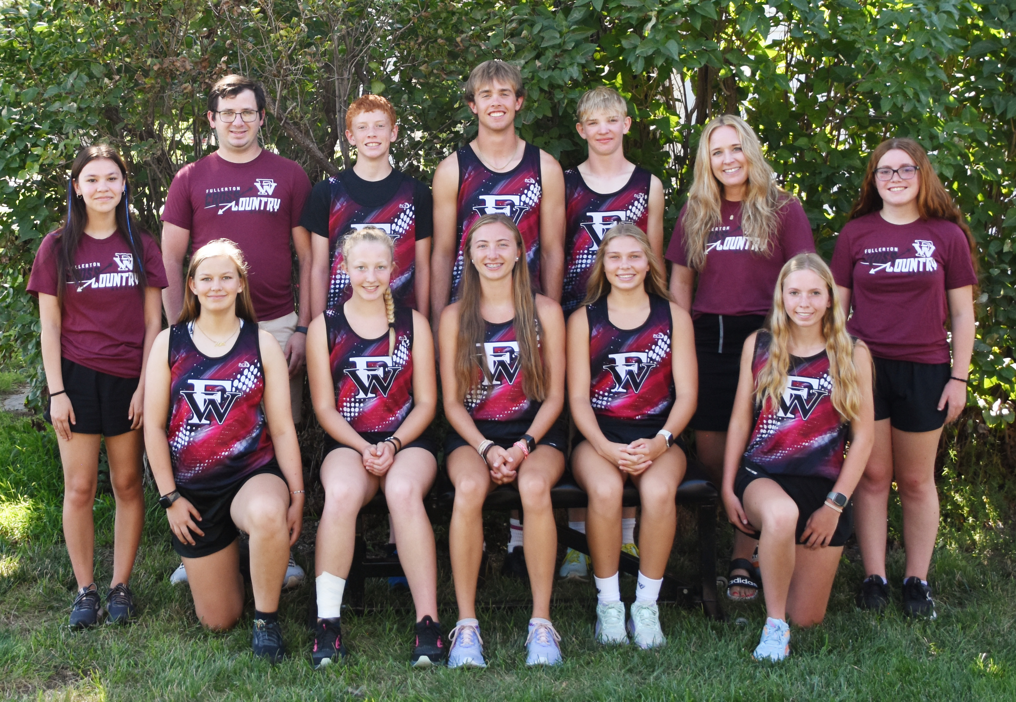 Fullerton has high expectations for the cross country season. Back Row: Student Manager Megan Toahty (left), Asst. Coach Jeremy Hubel, Jacob Maxfield, Justin Horn, Tate Wood, Head Coach Jordan Wetovick, Student Manager Peyton Thomas. Front Row: Delylla Olson, Elaina Reimer, Makayla Robinson, Morgan Supik, Emilyn Kurz. NCJ photo by Laura Sabata