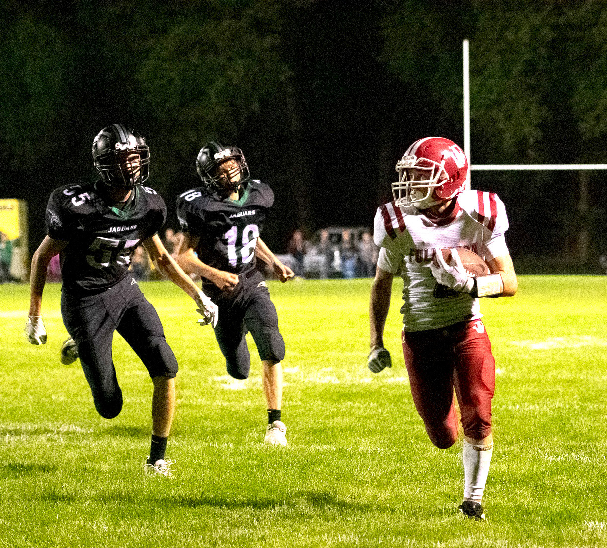 Isaac Supik finds room on the sideline on his way to a touchdown. NCJ photo by Melissa Aaberg