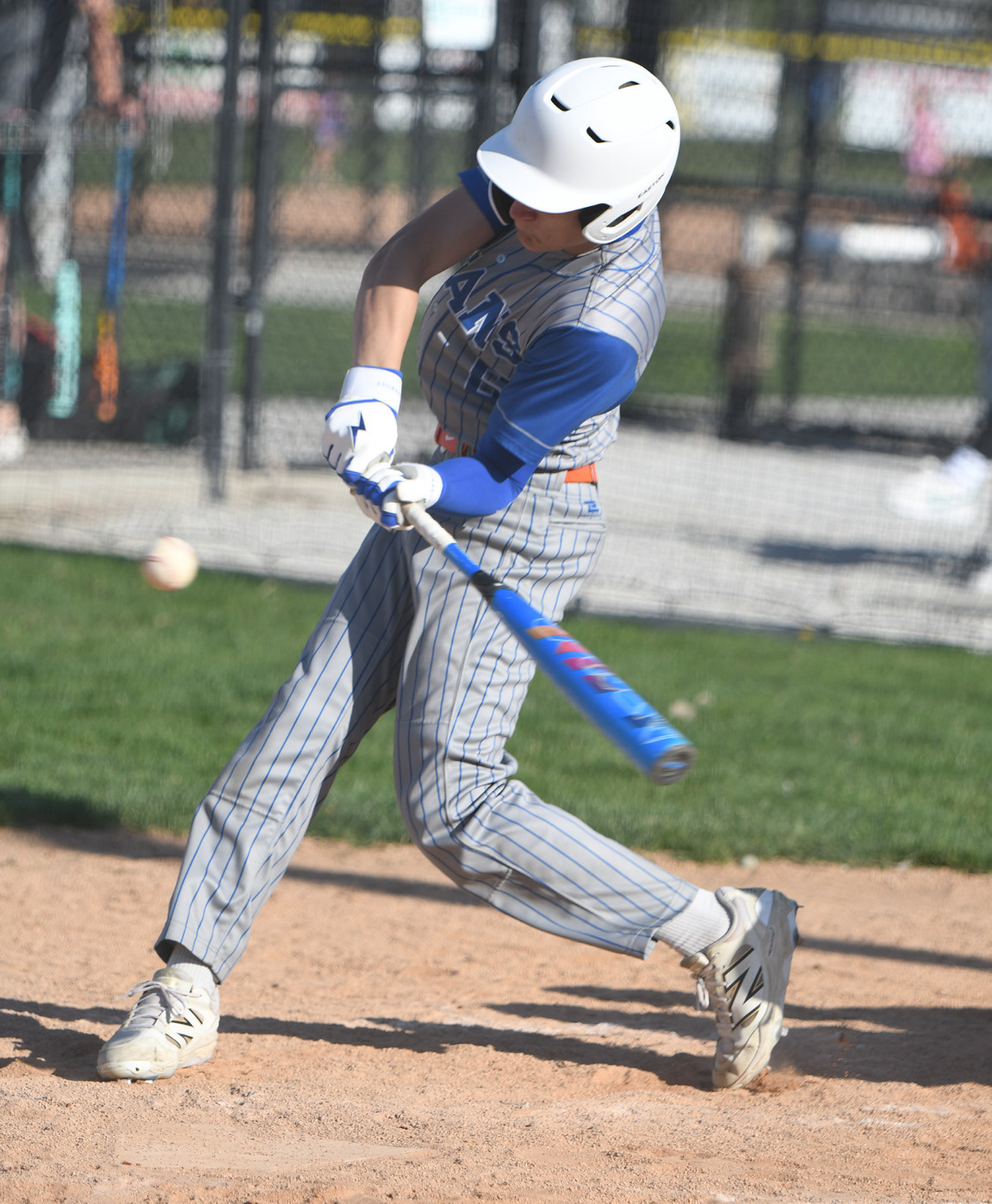 Braxtin Fowler hits a ground ball in the sixth inning. He reached base on an error and later scored in the inning. NCJ photos by Rick Holtz
