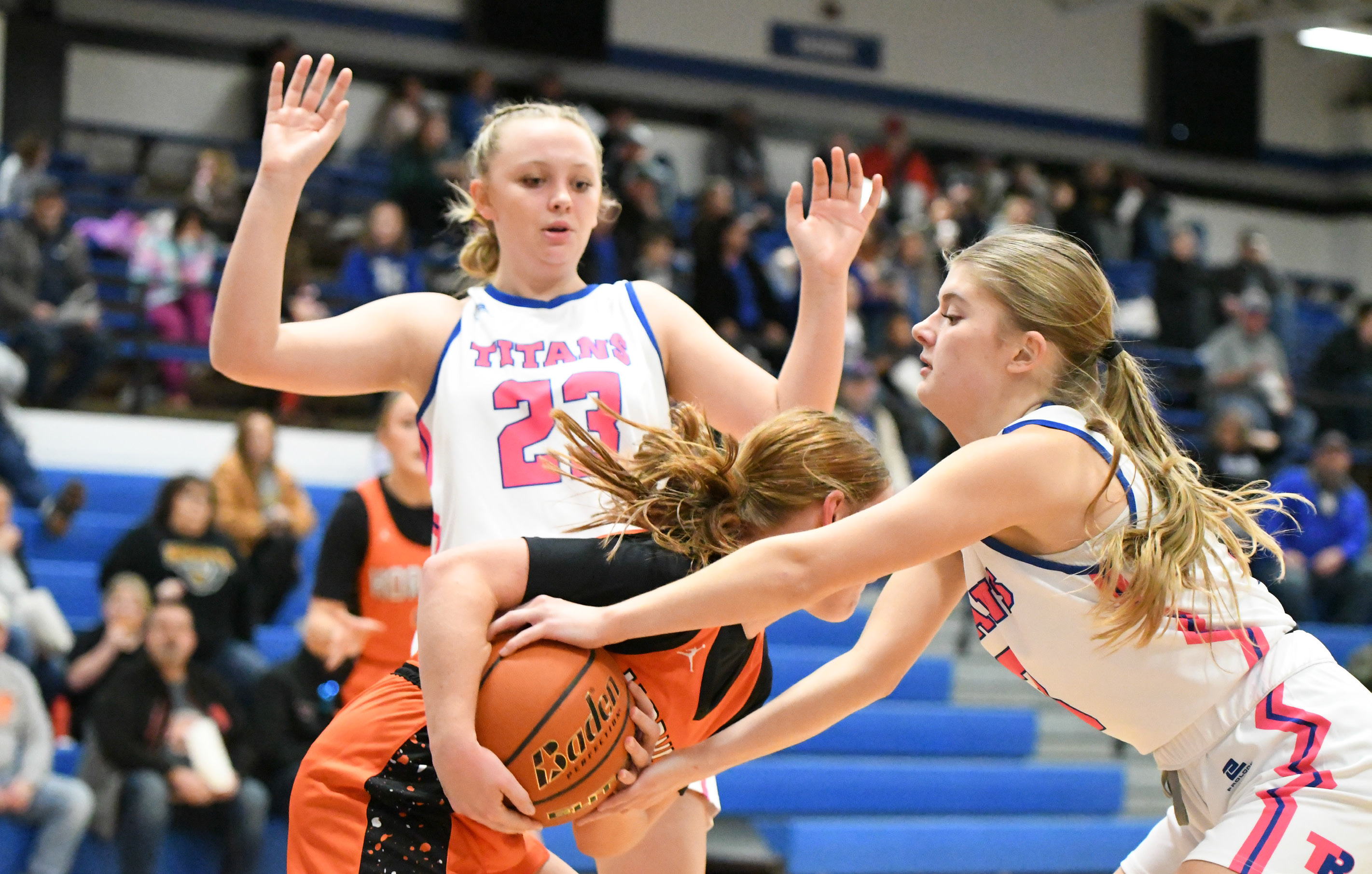 Mya Ramaekers (left) and Parker Zabka apply pressure on the Giltner ballhandler during the first half on Friday. NCJ photos by Rick Holtz