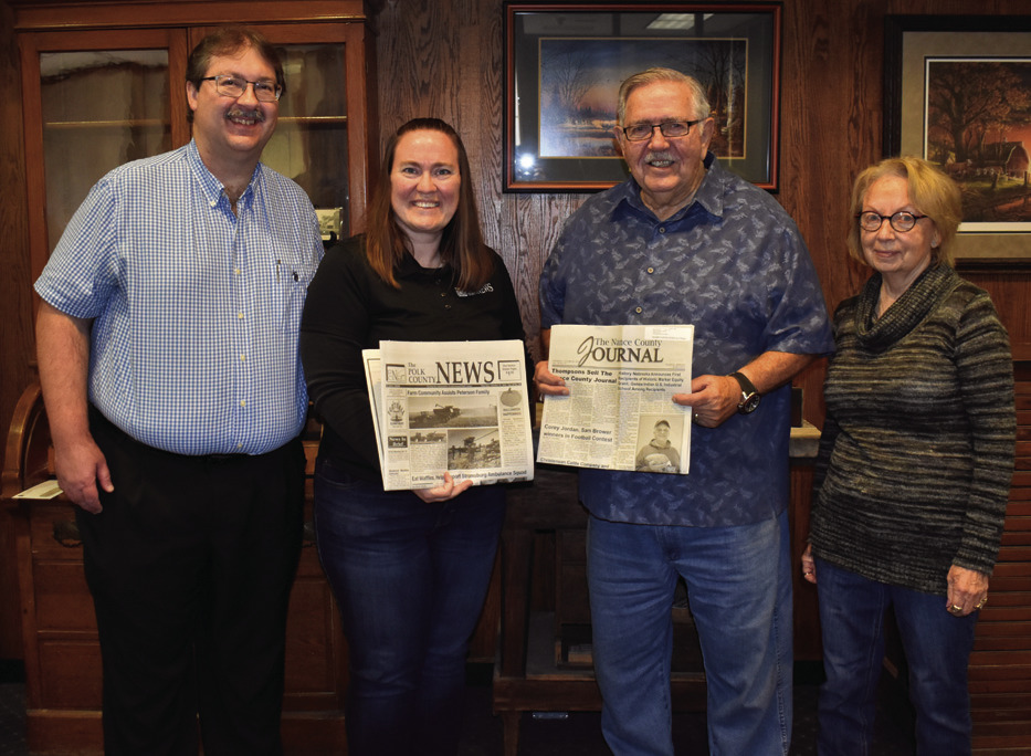 Shown (from left) are new owners Alan and Beth Sparrow, and Bill and Jan Thompson.