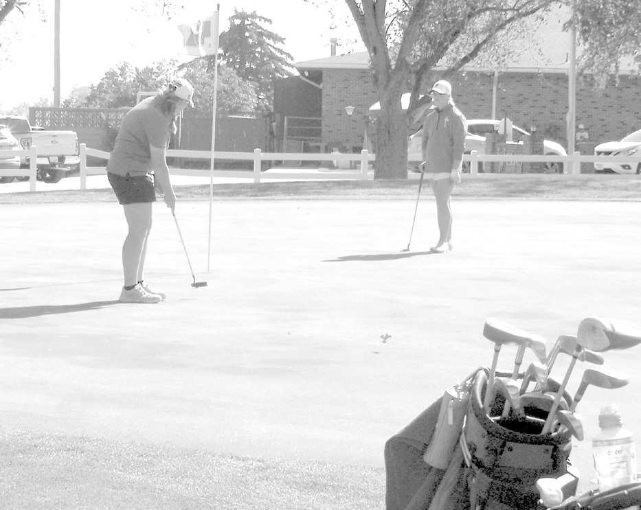 Emily Beed making the last putt of her high school career on day two of State Golf at the Elks Country Club in Columbus. Courtesy photo