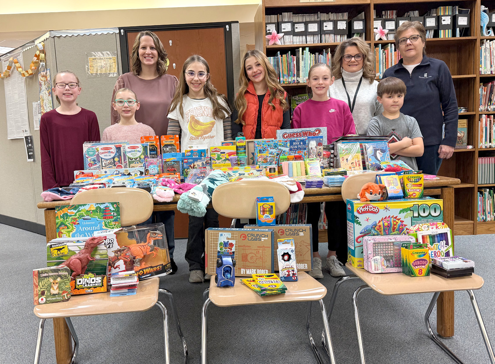 Fullerton students donated toys to Boone County Health Center. Paisley Jazwick (left), Grace Crouse, Miranda Jazwick, Rayna Hamik, Carly Malander, Molly Dubas, Melissa Aaberg, Jett Malander, Cindy Lesiak. NCJ photo by Rick Holtz