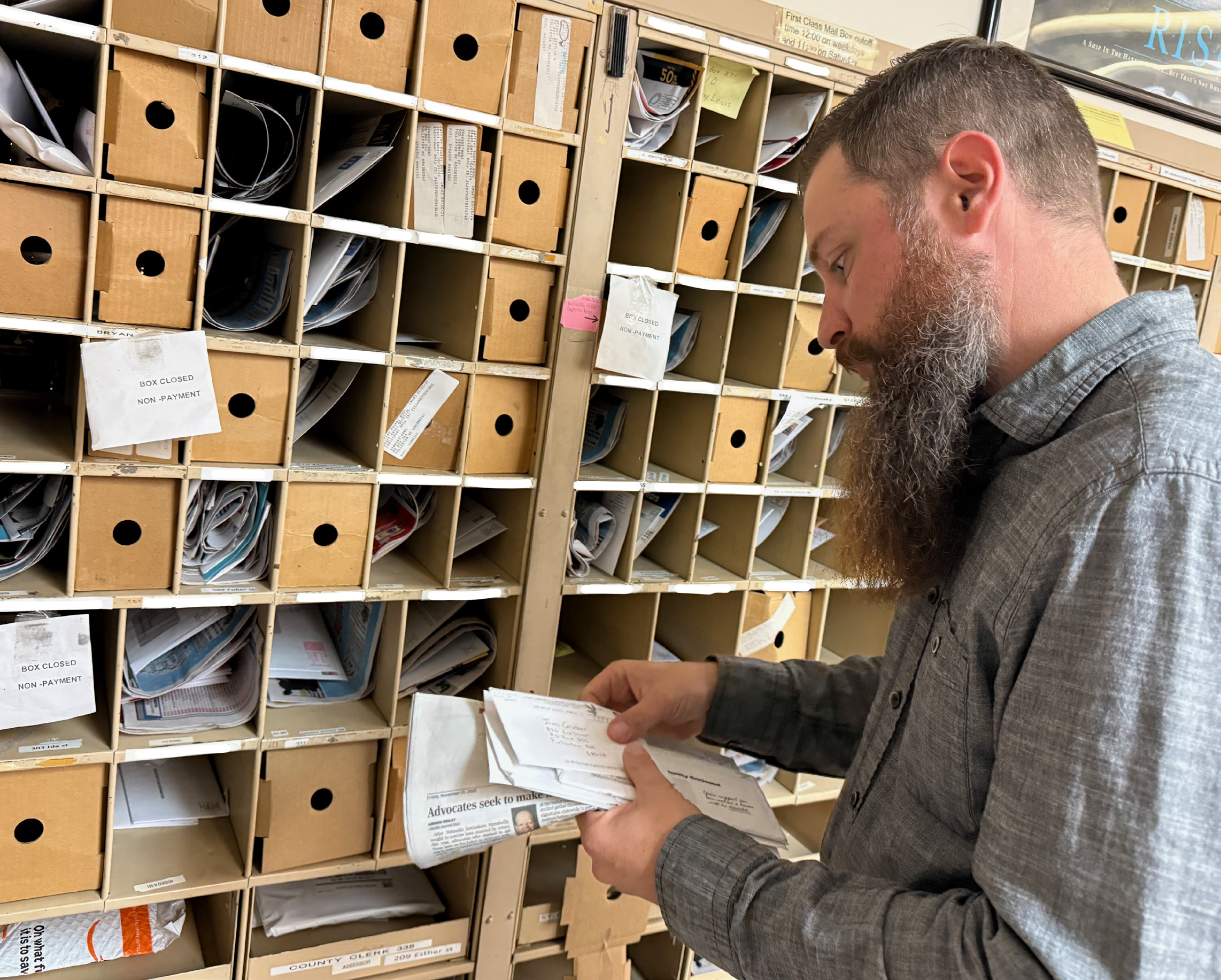 Fullerton Postmaster Tom Bates sorts mail ahead of the holiday rush. NCJ photo by Rick Holtz