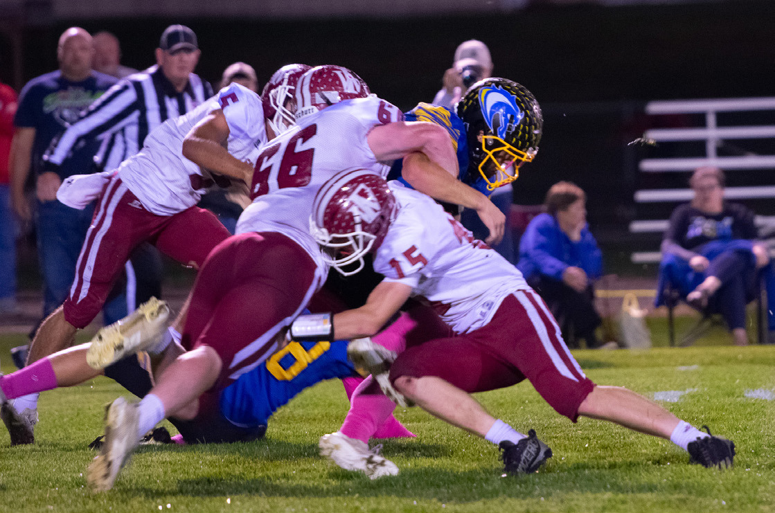 Aidan Bittner and Landen Glup make the stop for the Warriors. NCJ photo by Melissa Aaberg