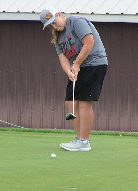 Tierney Russell putts on hole No. 3 on her way to leading the team with a 47 and a 2nd place finish in the dual. Photo provided