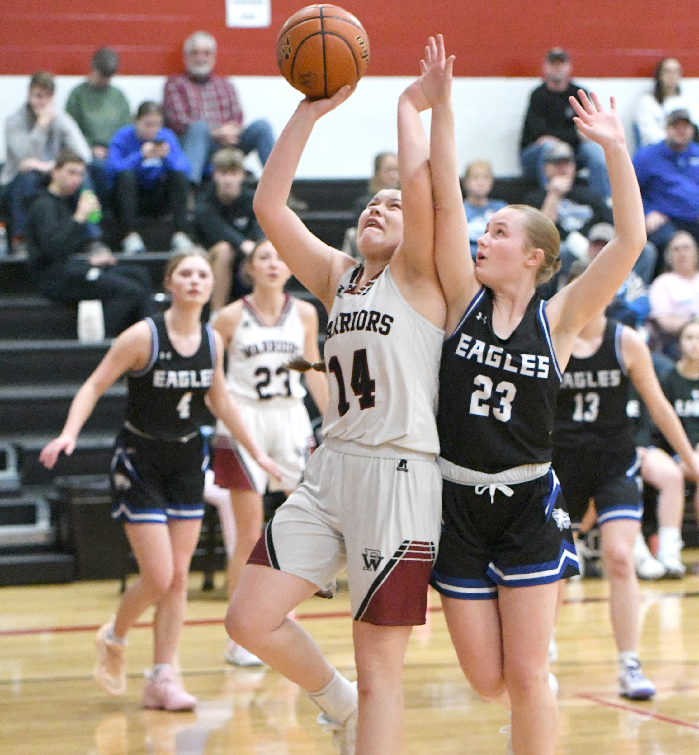 Georgia Bridger goes up strong for 2 of her 11 points in the first half against Lutheran-Northeast. NCJ photo by Rick Holtz