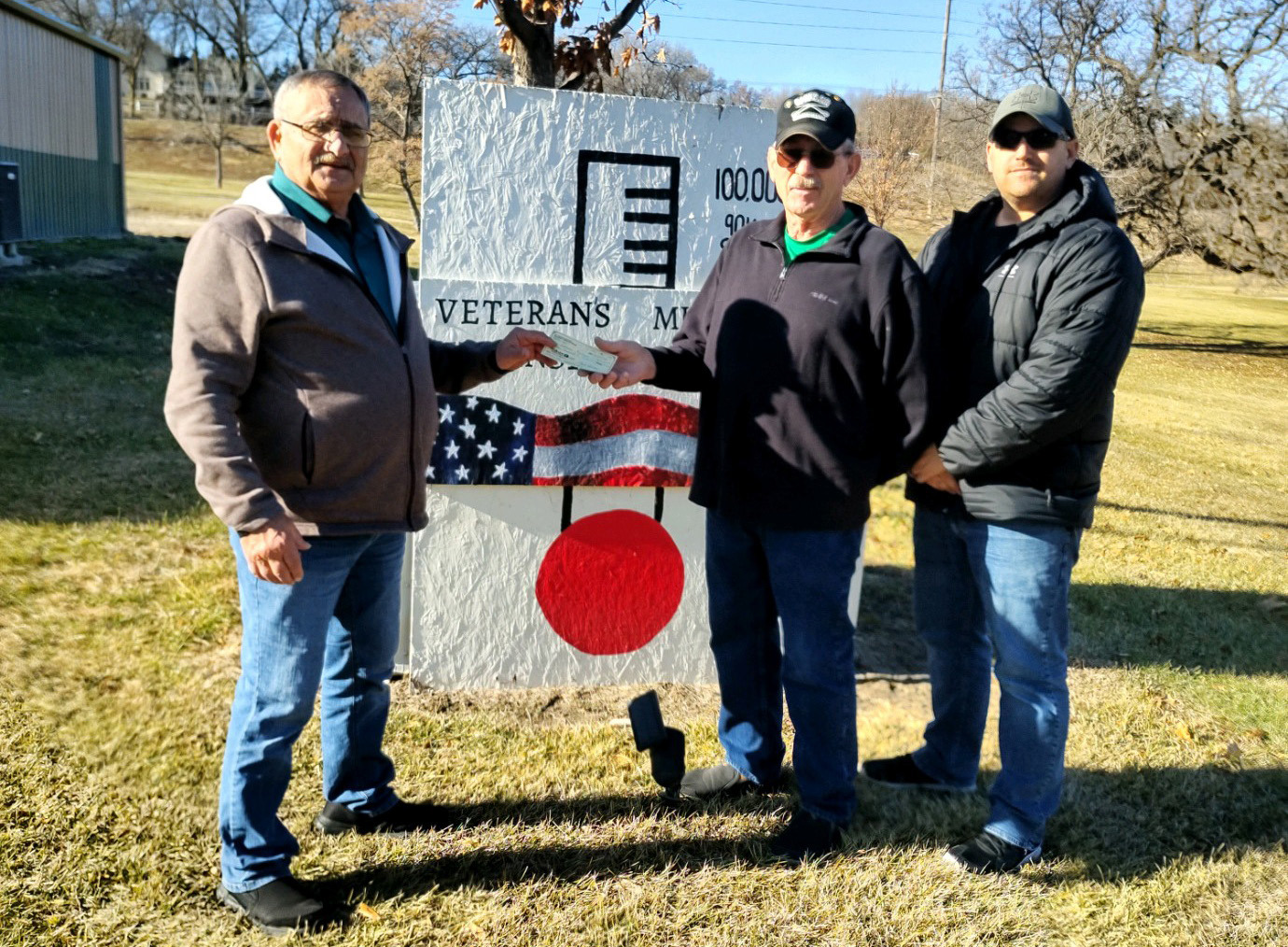 Eagles Treasurer Paul Bialas presents a check to John Epley and Dillon Busch for the Veteran’s Museum expansion project. Photos provided