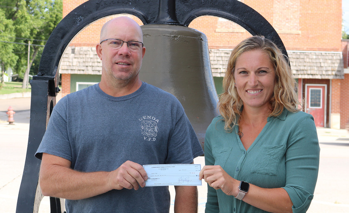 Cornhusker Public Power District Goodwill Fund Trustee Abie Czapla (right) presents $500 to the Genoa Fire Department for rescue ropes and atmospheric monitors. Accepting the check is Fire Chief Shawn Strain (left). 