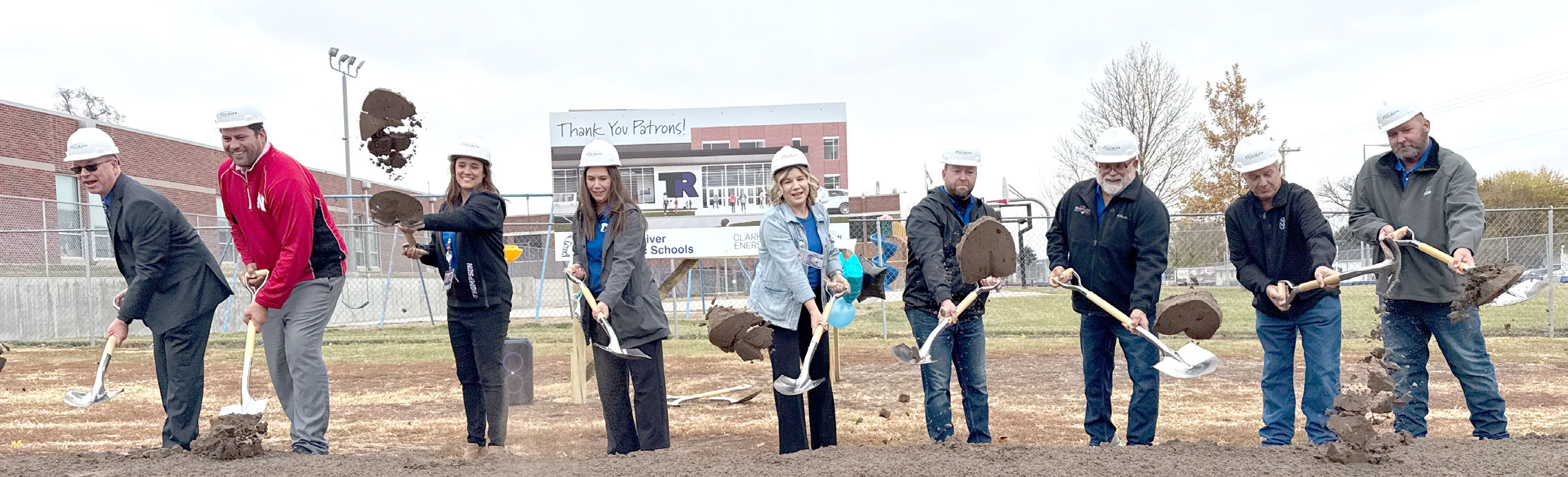 Members of the Twin River Board of Education were joined by administrators to move the first shovels of dirt in the district’s $39.9 million building project. NCJ photo by Rick Holtz