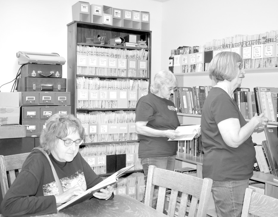 There was so much to look through at the Library’s Resource Center it was hard to know what to pick out first. Seated is Rhonda Richards of Albion, while Deb Landauer of Albion (middle) and Marlene Laska of St. Edward scan through various items.