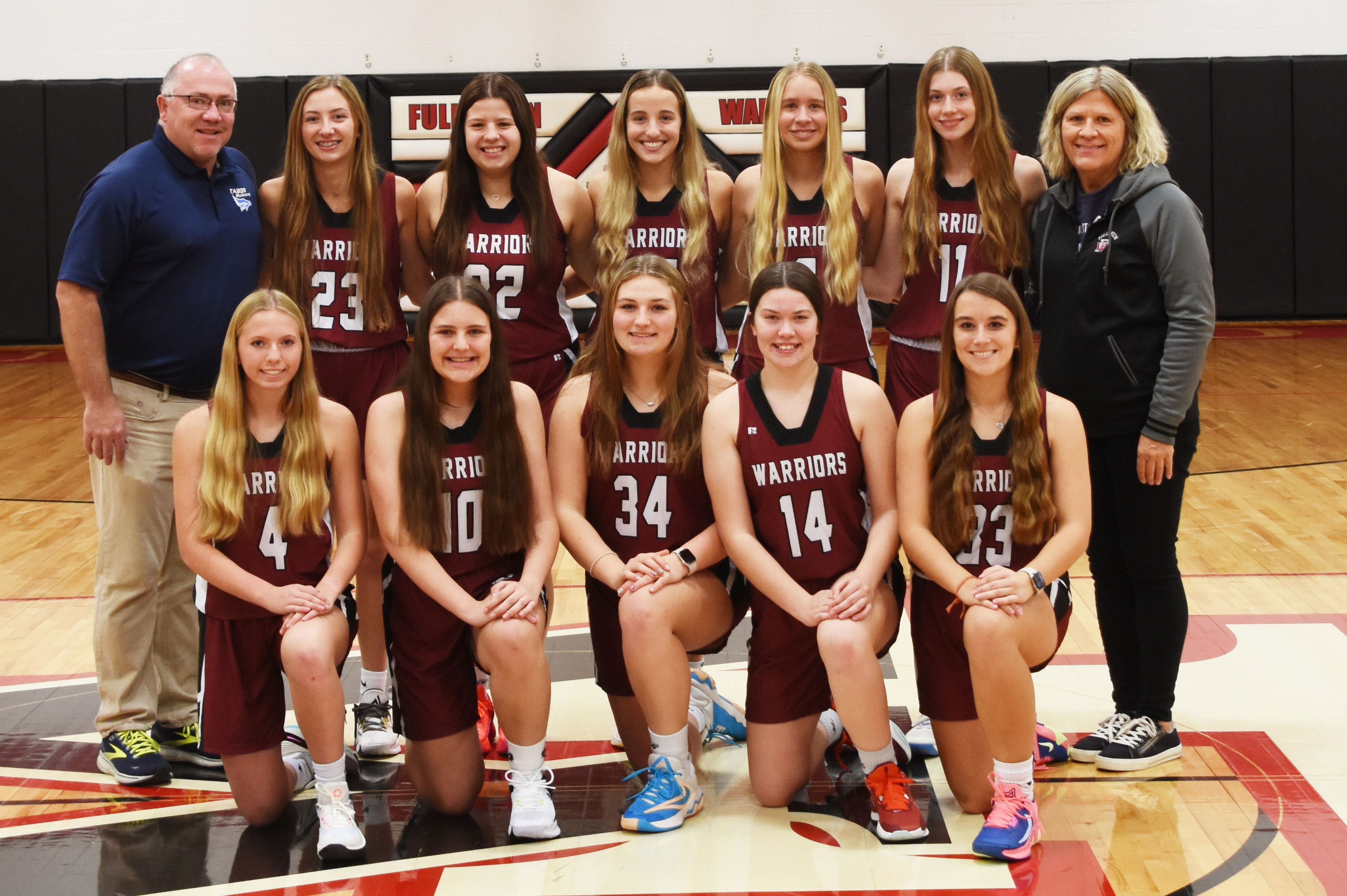 Fullerton girls basketball will look to improve throughout the entire season. This year’s team consists of Emilyn Kurz (front left), Lylla Sabata, Ella Pickrel, Georgia Bridger, Keila Dubas, Coach Jason Maxfield (back left), Makayla Robinson, Melinda Pickrel, Isabel Norman, Paige Horn, Jaci Maxfield and Coach Shelly McNeff. Photo provided