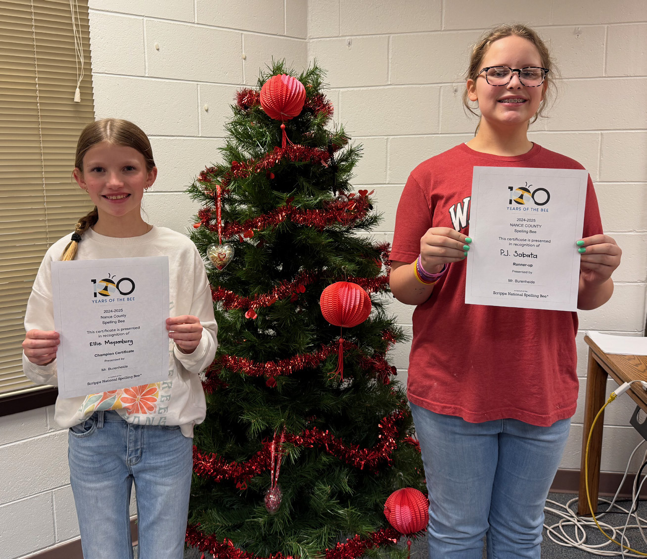 Ellie Meysenburg (left) won the Nance County Spelling Bee on Wednesday at Fullerton High School. P.J. Sabata was the runner-up for the second year in a row. NCJ photo by Rick Holtz