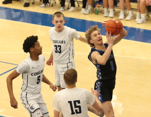 Colsten Rodriguez finishes at the basket for two of his game-high 26 points as the Titans were able to avenge a 34-point loss from 11 days earlier. NCJ photo by Ken Kush