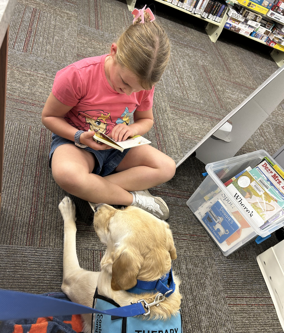Fletch reading with Charlotte Bittner at the library. Charlotte is the daughter of Mike and Rachel Bittner. Photo provided