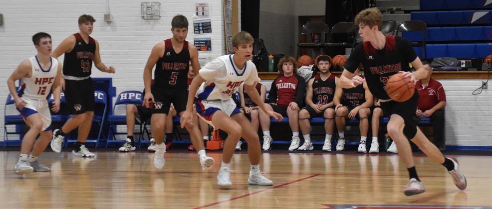 Kane Wetovick looks for a path to the basket against High Plains. NCJ photo by Beth Sparrow