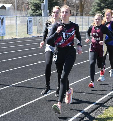 Fullerton's Makayla Robinson (front) leads Twin River's Angelia Graham early in the 1600-meter run. Graham finished second and Robinson finished third. NCJ photo by Rick Holtz