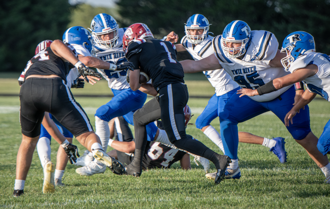 The Titan defense collapses on the rusher to make a stop. NCJ photo by Rick Holtz