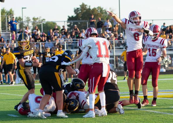 The Warriors gain a first down during the first half of Friday’s season-opener. NCJ photo by Melissa Aaberg