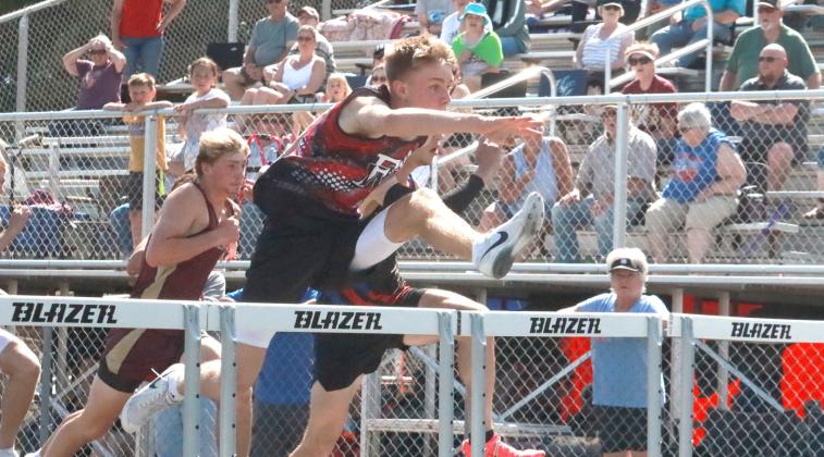Kyle Horn qualified for State in the 110 and 300-meter hurdles and as a member of the 800-meter relay team. NCJ photos by Ken Kush