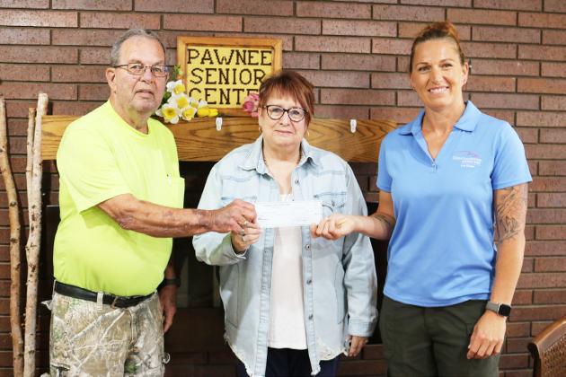 Cornhusker Public Power District Goodwill Fund Trustee Abie Czapla (right) presents $250 to Pawnee Sr. Center for an office chair. Accepting the check are Board President Calvin Becker (left) and Manager Vicki Cromwell (middle).