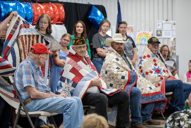 Four veterans received Quilts of Valor last week during the Nance County Fair. Rodney Russell, Russell Sprague, Chad Coon and Mike Frey were this year’s honored recipients. NCJ photos by Rick Holtz