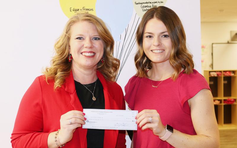 LEFT: Cornhusker Public Power Trustee Abie Czapla (right) presents $500 to Belgrade Fire Department for CO2 detectors. Accepting the check is Fire Chief Bob Dodds (left). RIGHT: Cornhusker Public Power Marketing and Communications Specialist Jessica Kurpgeweit (left) presents $300 to Fullerton’s Future Inc. for an office computer. Accepting the check is Director Carlee Konz (right). Photos provided