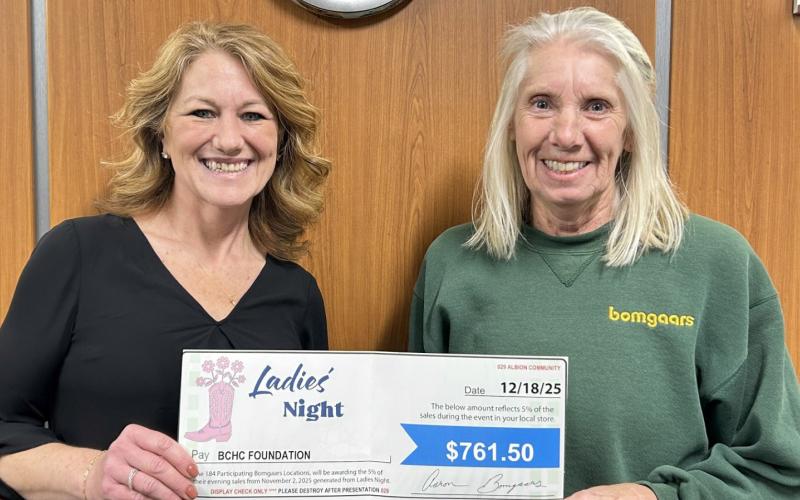 Cindy Bolin, General Manager of the Albion Bomgaars location, presents a donation check to Sarah Grape, BCHC Foundation Director. Photo provided