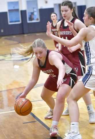 Kaycee Harter looks to make a move toward the basket in the first quarter.  NCJ photos by Rick Holtz