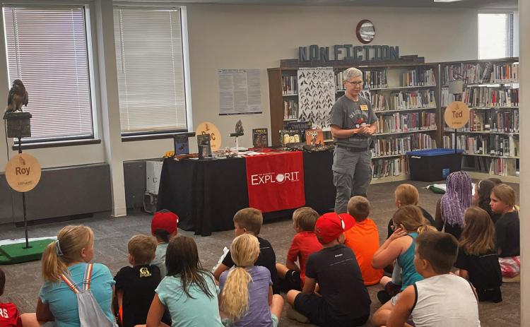 Deb Miller talks to the group about the different birds she brought with her on Tuesday. She showed three different birds, a falcon, a hawk and an owl. NCJ photos by Amarha Bridger