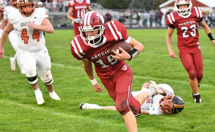 Fullerton sophomore Landen Glup shakes off a defender after catching a pass on Friday. He finished with 5 catches for 59 yards. NCJ photo by Rick Holtz